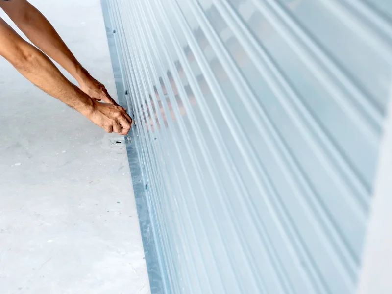 Close-up of white sectional garage door panels