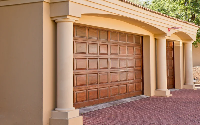 Decorative wooden garage door with an arched frame