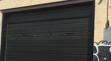 Black garage door with horizontal panels