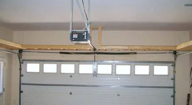 Overhead garage door opener rail and mechanism